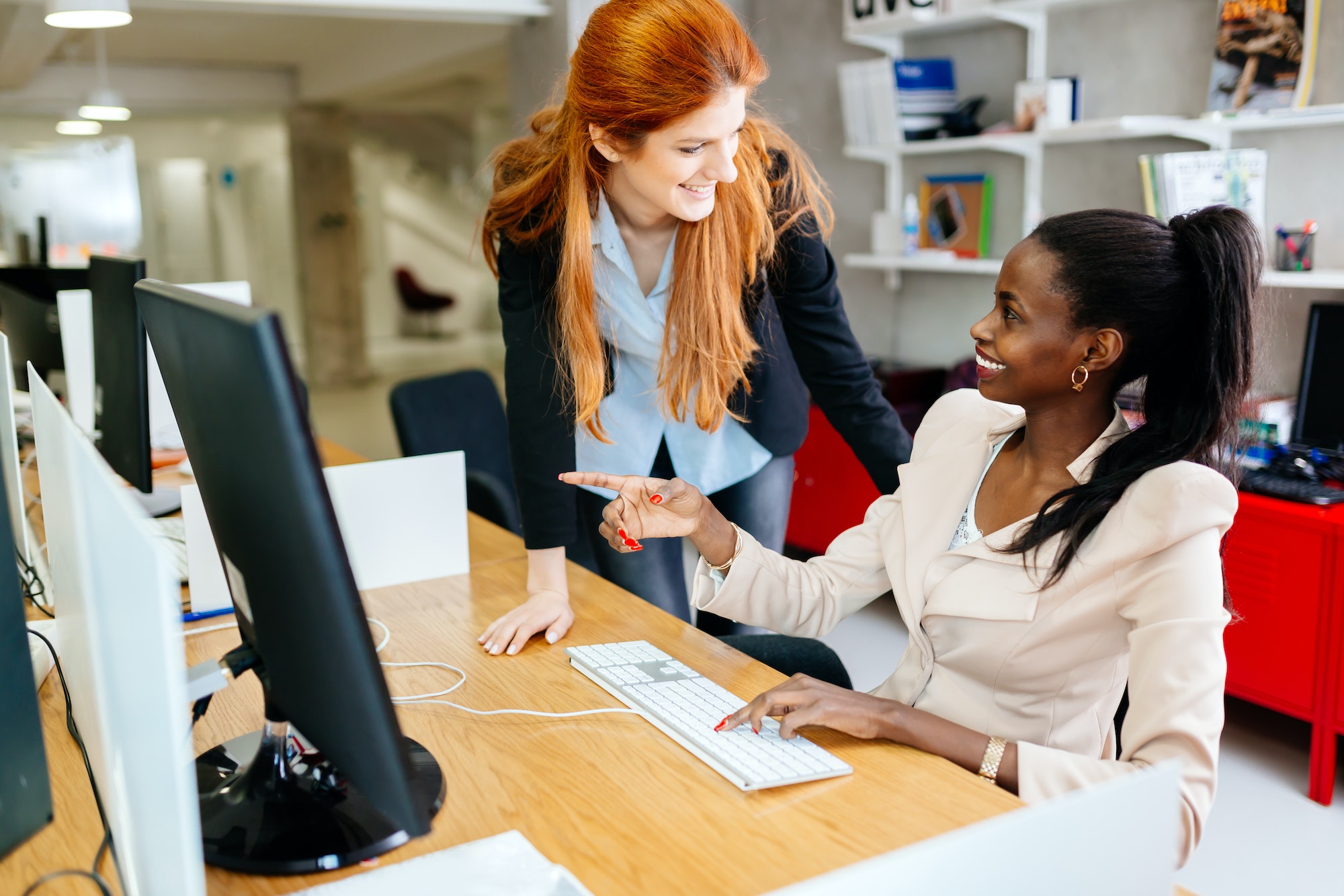 Businesswoman supervising employee