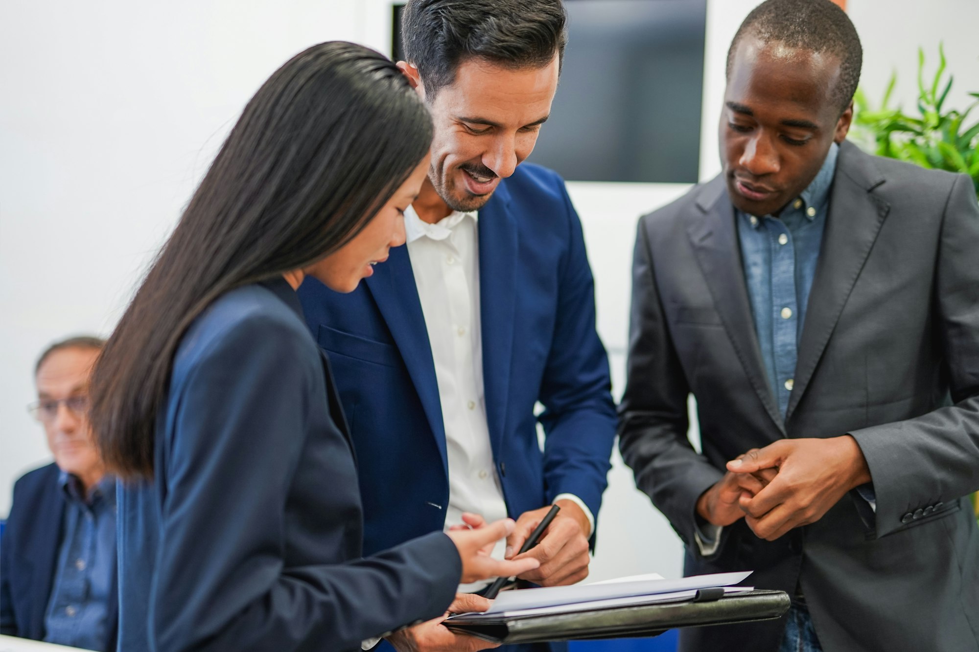Multiracial business people doing team meeting inside modern office